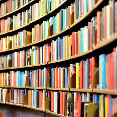 a bookshelf filled with colourful books